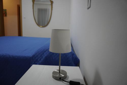 Ένα ή περισσότερα κρεβάτια σε δωμάτιο στο Oliva's House con giardino