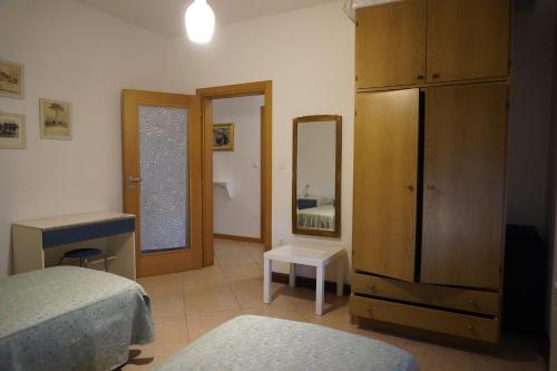 Ένα ή περισσότερα κρεβάτια σε δωμάτιο στο Oliva's House con giardino