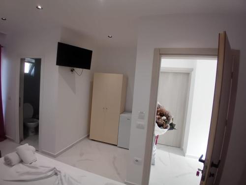 Un ou plusieurs lits dans un hébergement de l'établissement Sela Apartaments