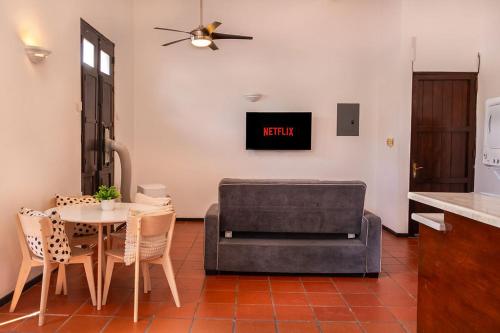 a living room with a table and a couch at Old San Juan Rentals in San Juan
