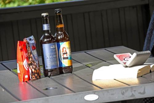 two bottles of beer sitting on a table at C11593-Hemmet-Bork-Hytteby-98 in Hemmet