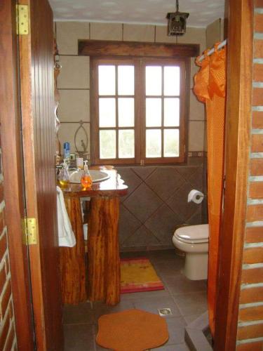 a bathroom with a sink and a toilet at Moranegra - Casa y Campo in Coroico