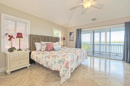 a bedroom with a bed and a ceiling fan at Mother Ocean in Key West