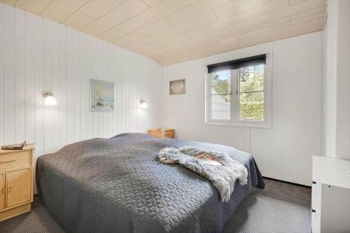 a bedroom with a bed and a window at C11204-Hemmet-Bowleren-1 in Hemmet