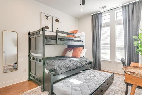 a bedroom with two bunk beds in a room at Heated Pool Family-Friendly Houston Area Home! in Manvel