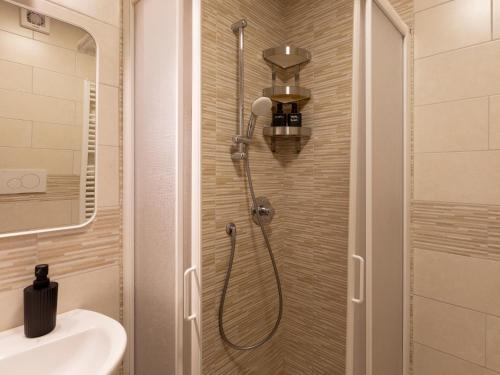 a shower in a bathroom with a toilet and a sink at Mountain Studio 109A in Breuil-Cervinia