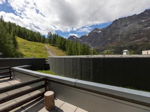 a bench on a balcony with a view of a mountain at Mountain Studio 109A in Breuil-Cervinia