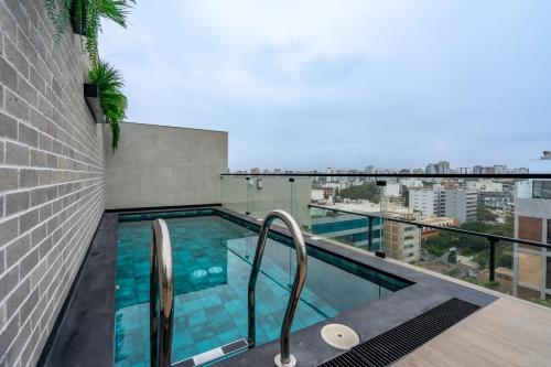 a swimming pool on the roof of a building at La Mar by Geko in Lima