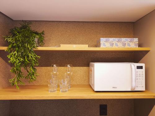 Η κουζίνα ή μικρή κουζίνα στο Flats térreo pé na areia no Alta Marine