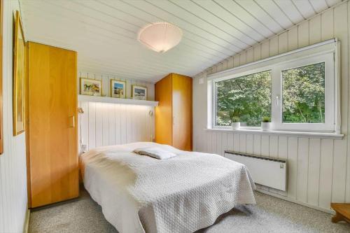 a bedroom with a bed and a window at C11663-Hemmet-Mosevaenget-9 in Hemmet