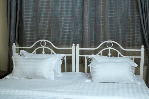 Katil atau katil-katil dalam bilik di Kandez Holiday Home