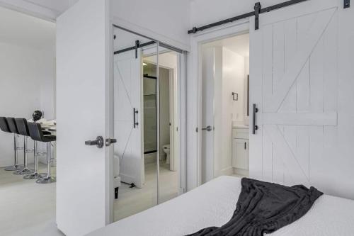 a bedroom with a bed and a sliding glass door at Luxury Private Apt at Disney Area in Orlando