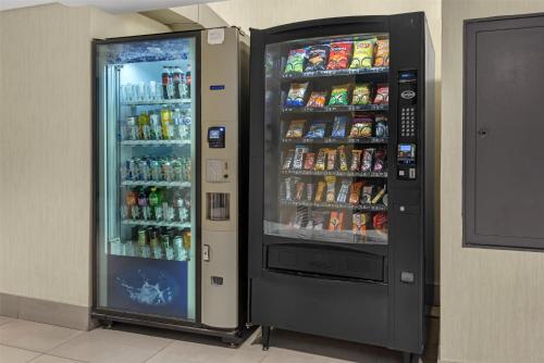 a soda vending machine in a building at Best Western Plus Suites Downtown Calgary in Calgary