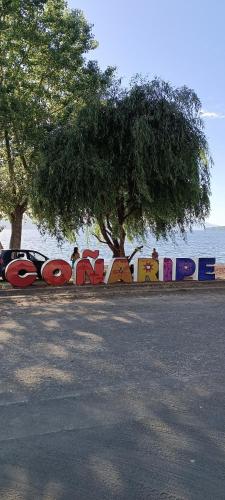 a sign that says pepole on the side of a street at Hostel Calafquen Adventure Coñaripe in Coñaripe