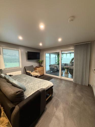 a bedroom with a bed and a view of the ocean at Deluxe Studio with Sauna and Jacuzzi - Adults only in Kildare