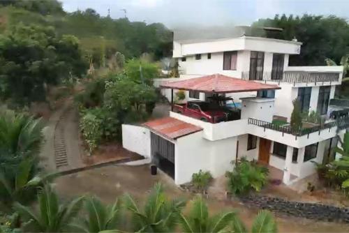 an image of a house at Coastal Villa Retreat with Private Jacuzzi and Garage Near Isla de la Plata in Puerto López