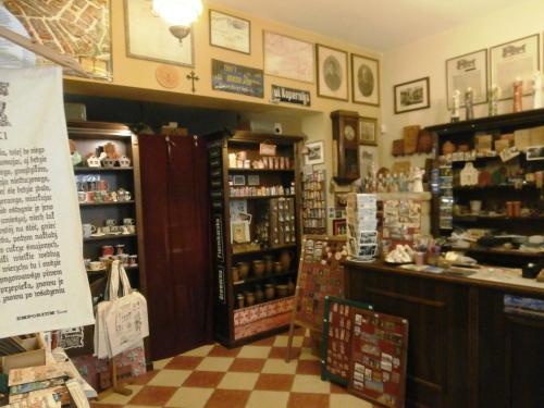 a shop with a store with a checkerboard floor at Planetarium - Stare Miasto, Parking Free in Toruń