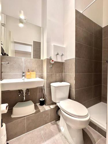 a bathroom with a toilet and a sink at Best Spot in XBerg in Berlin