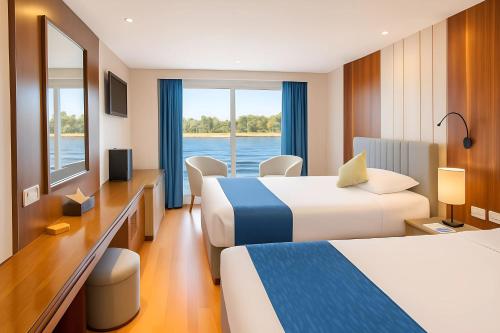 Ένα ή περισσότερα κρεβάτια σε δωμάτιο στο Rene Floating Hotel