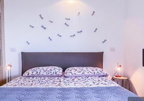 Ένα ή περισσότερα κρεβάτια σε δωμάτιο στο Olbia Airport Apartment