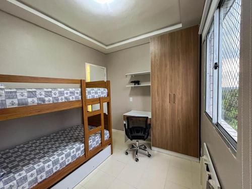 Ένα ή περισσότερα κρεβάτια σε δωμάτιο στο Viva o conforto da primeira locação!