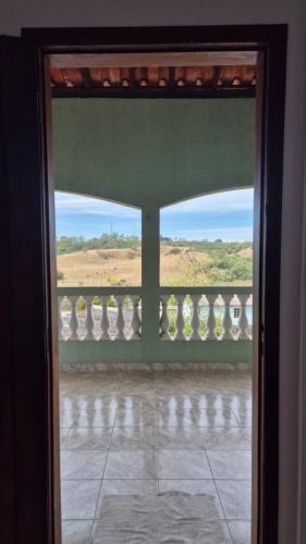 an open door to a balcony with a view at Suíte319 in São José dos Campos