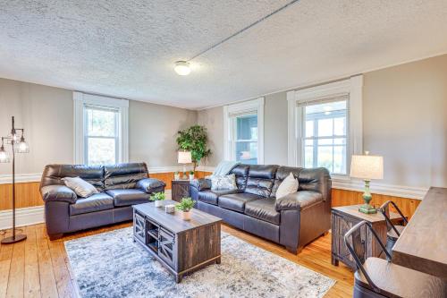 a living room with two leather couches and a table at Less Than 1 Mi to Lake Mtn-View Cabin with Porch in Newport in Newport