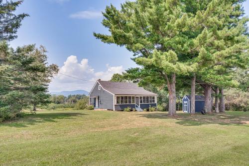 a farmhouse with trees in the yard at Less Than 1 Mi to Lake Mtn-View Cabin with Porch in Newport in Newport