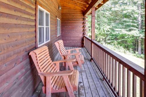 two chairs sitting on the porch of a cabin at 4 Mi to Mount Snow West Dover Cabin with Game Room in West Dover