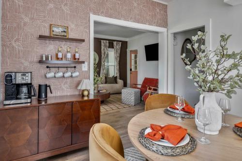 a kitchen and living room with a table and chairs at Hudson Valley Hot Tub Sauna Fire Pit Games in Hudson