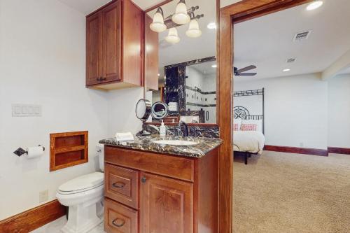 a bathroom with a sink and a toilet at Harbor Point in Spicewood