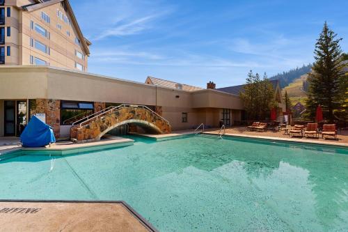 a large swimming pool with a slide in a building at Shoshone 1930 in Big Sky