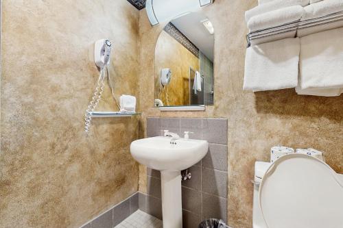 a bathroom with a sink and a mirror at Shoshone 1930 in Big Sky