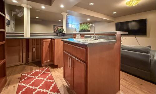 a large kitchen with a sink and a couch at Dream Retreat Indiana Dunes National Park in Tolleston