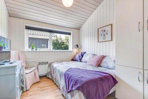a bedroom with a bed and a window at C11330-Tarm-Blabaervej-14 in Tarm