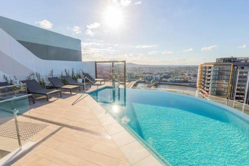 a swimming pool on the roof of a building at AirTrip Apartments at South Brisbane in Brisbane
