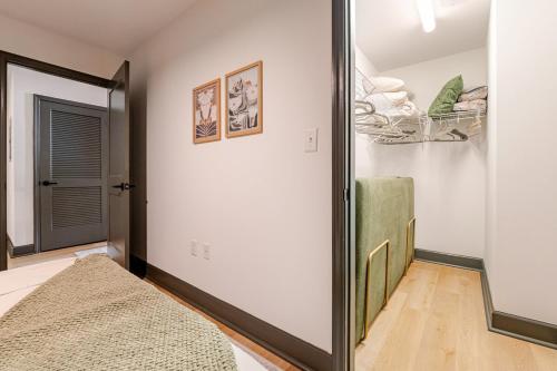 a bedroom with a mirror next to a door at Elegant Scandinavian Escape Birmingham in Birmingham