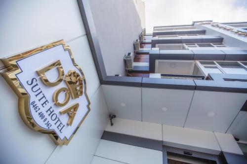 a sign on the side of a building at Doa Suite Hotel in Trabzon