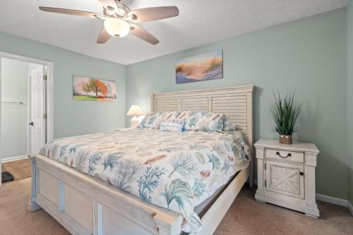 a bedroom with a bed and a ceiling fan at Charming upgraded 2-bed condo in amazing Pawleys Island True Blue Golf Course in Pawleys Island