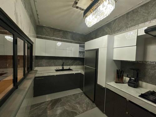 a large kitchen with a sink and a counter at Casa Catorce Loft in Parras de la Fuente
