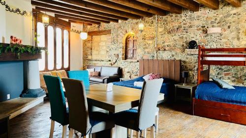 a room with a table and chairs and a bedroom at Tizapan 05 NEW 1BE&1BA in Mexico City