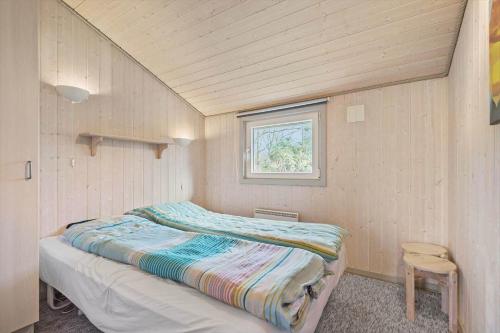 a bedroom with a bed in a room with a window at C11216-Hemmet-Ildervej-5 in Hemmet