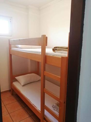 a room with a bunk bed in a room at Apartment Kustici 4129b in Kustići