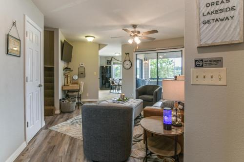 a living room with a couch and a table at Table Rock Lake Retreat Steps to Water and Pools! in Kimberling City