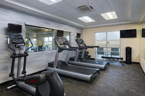 a gym with treadmills and ellipticals in a room at Fairfield Inn & Suites by Marriott Fredericksburg Texas in Fredericksburg