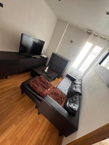Χώρος καθιστικού στο Appartement F2 bien équipé et proche de la gare et de Paris par train