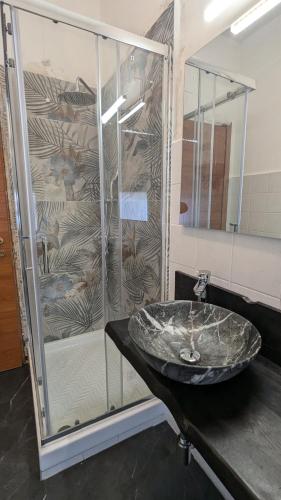 a bathroom with a sink and a shower at Marconi Rooms and Apartments in Verona