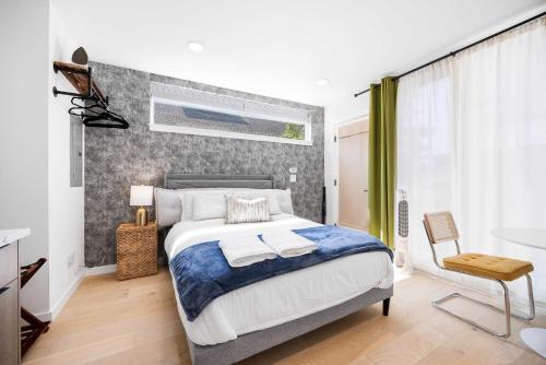 a bedroom with a large bed and a window at Brand New Eastlake Studio - SLU UW Shops & Eats in Seattle
