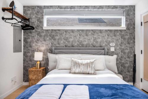 a bedroom with a large bed and a window at Brand New Eastlake Studio - SLU UW Shops & Eats in Seattle