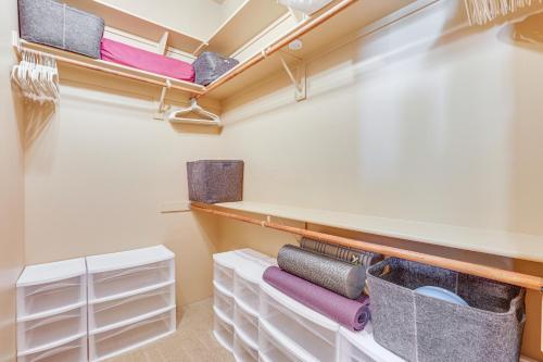 a walk in closet with white drawers and shelves at The Hideaway - Santa Fe-Style Home in Rio Verde! in Rio Verde
